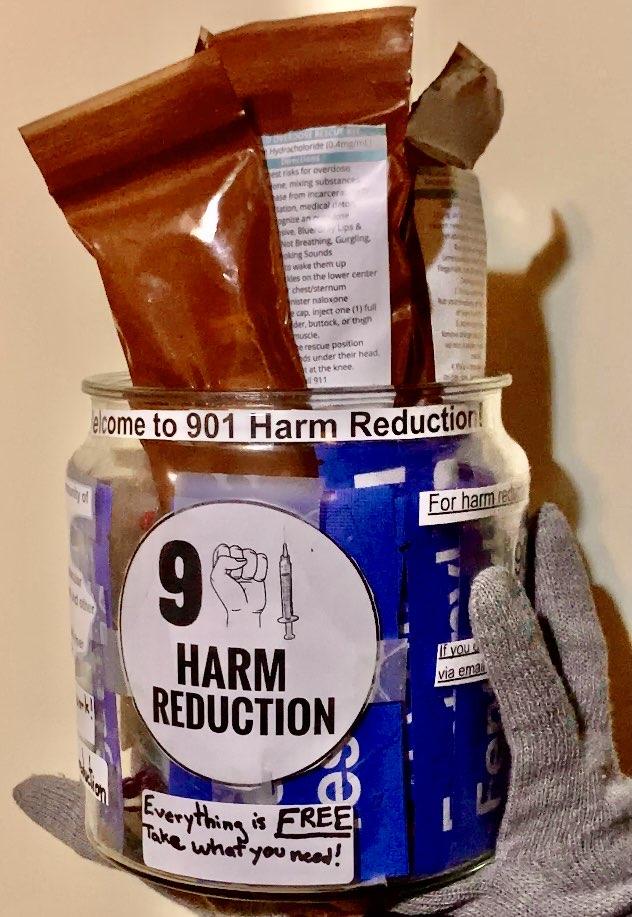 a jar of opioid overdose reversal kits. a sticker with the 901HR logo is attached.